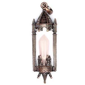 Detailed view of a vintage copper castle pendant with a pink crystal hexagonal point.