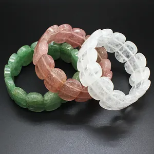 Detail shot of oval natural stone bracelets in green, pink and white crystal