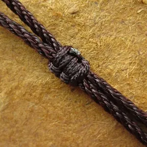 Durable hand-braided brown necklace cord featuring a secure adjustable knot for jewelry pendants