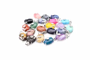 Collection of natural stone crystal oval pendants with silver floral design details
