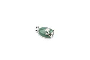Close-up of green natural stone pendant with silver floral design overlay.