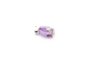 Detailed macro view of purple agate stone pendant with delicate silver floral motif