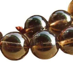 Close-up of polished natural smoky quartz loose beads for DIY jewelry making accessories