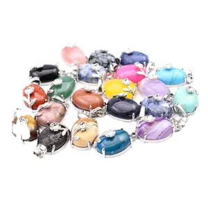 Collection of natural stone crystal oval pendants featuring silver floral metal accents