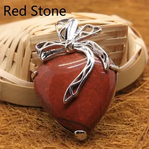 Heart-shaped red jasper stone pendant featuring an elegant silver-colored metal bow detail