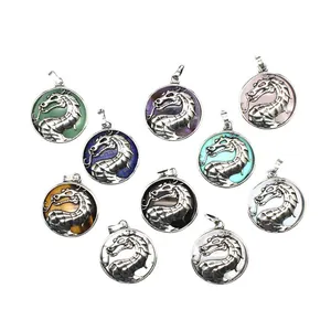 Set of mythical dragon pendants with various colored gemstone inlays on white background