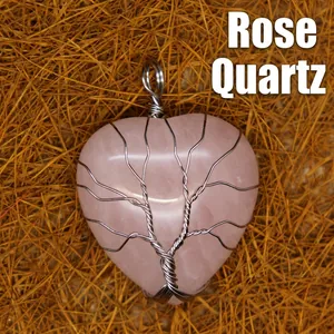 Rose quartz heart pendant necklace featuring a silver wire wrapped tree of life