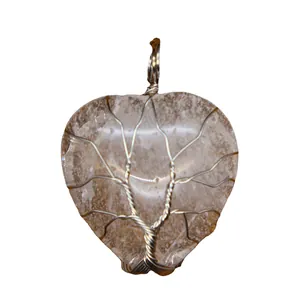 Exquisite heart-shaped crystal pendant featuring a silver wire-wrapped tree of life motif