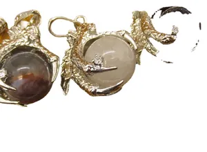 Gothic style dragon claw necklace pendant holding crystal and marbled natural stone spheres
