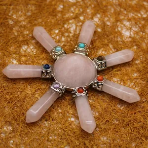 Rose quartz crystal grid with hexagonal pillars and chakra stones decoration
