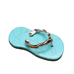 Creative flip-flop pendant with turquoise stone base and silver wavy strap detail