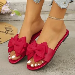 Eleganti sandali bassi rossi con grande fiocco per abbigliamento estivo