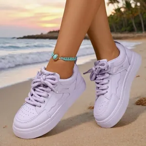 2026 New lavender purple platform sneakers for women on a beach sunset background