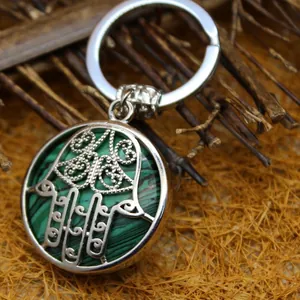 Ethnic Hamsa hand keychain featuring a green malachite stone circular pendant accessory