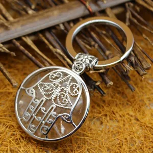 Ethic Hamsa hand crystal keychain with silver circular pendant