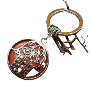Ethnic Hamsa hand pendant keychain with red agate stone and silver metal finish