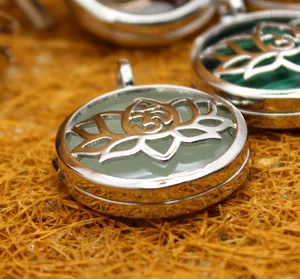 Retro lotus flower locket pendant with Om symbol and green gemstone insert