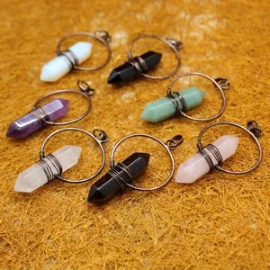 Selection of hexagonal crystal column pendants with wire-wrapped spiritual design on circles