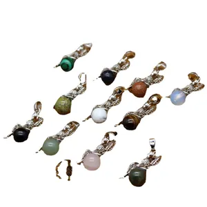 Selection of crystal ball pendants in various natural stones for jewelry making