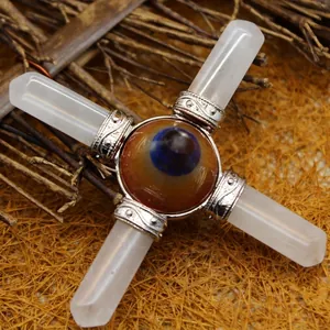 White crystal cross ornament with central eye-pattern stone for spiritual home decor