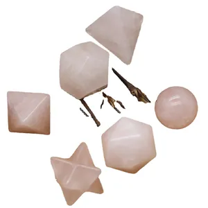 Natural rose quartz geometric ornaments set featuring sphere, pyramid, and star shapes