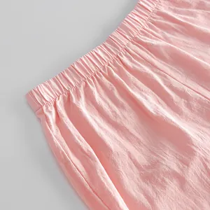 Close-up of pink cotton shorts elastic waistband showing soft fabric texture