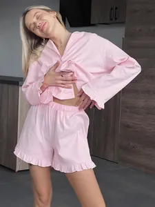 Sweet pink two-piece cotton loungewear set with ruffle trim long sleeve shirt and shorts