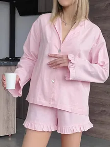 Sweet pink cotton two-piece pajama set with long sleeve top and ruffle shorts
