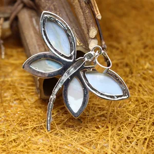 Elegant handcrafted abalone shell dragonfly pendant necklace with a silver-tone finish