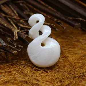 White mother of pearl shell pendant with an elegant double twist pikorua carving detail