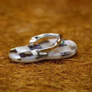 Unique flip-flop pendant necklace with checkered abalone shell and mother of pearl inlay.