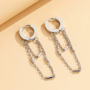 Detailed shot of stainless steel tassel chain hoop earrings with metallic silver finish