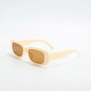 Retro small rectangular sunglasses with cream frames and brown lenses detail view