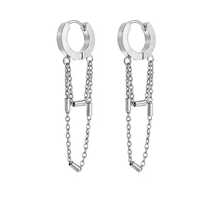 Detail view of silver stainless steel hoop earrings with long hanging tassel chains.