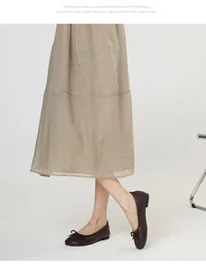 Detailed side view of dark brown Tabi-style flat shoes with bow knot on the vamp