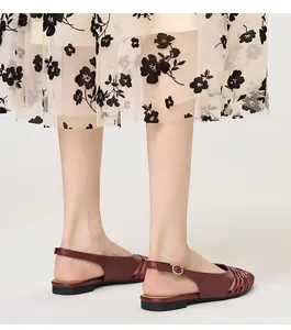 Close-up detail of burgundy retro woven slingback flats with a pointed toe design