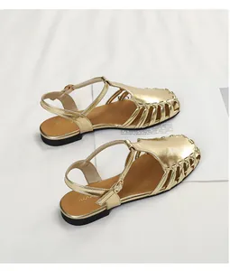 Vintage gold metallic hollow closed-toe sandals for women with elegant buckle strap detail