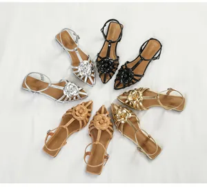 Elegant camellia flat sandals for women in gold, silver, black, and beige colors.