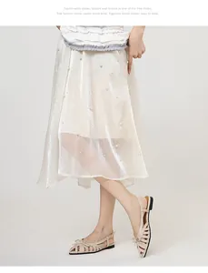 Close-up of French bow woven cutout retro closed-toe Roman sandals worn by model