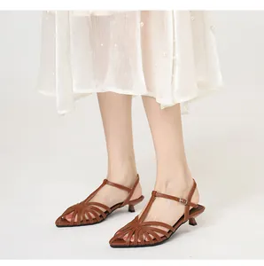 Brown woven pointed toe kitten heel sandals with elegant cutout straps design.
