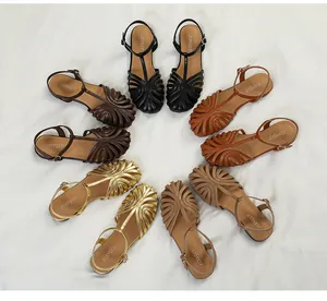 Multiple colors of retro hollow T-strap flat sandals arranged in a circle