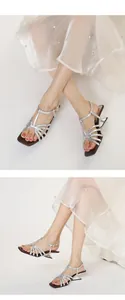 Silver strappy sandals with architectural kitten heels and a chic square toe design