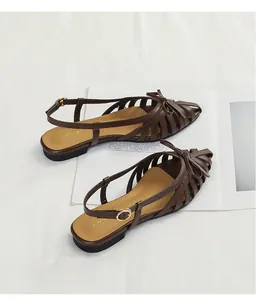 Elegant brown French retro woven hollow-out sandals with bow detail and slingback strap