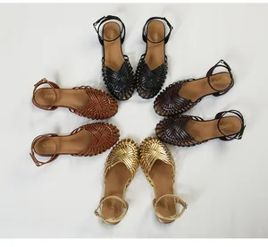 Detailed view of hand-woven retro Roman style closed-toe sandals in multiple colors