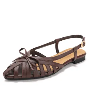 Elegant brown woven slingback sandals with pointed toe and bow detail for summer.