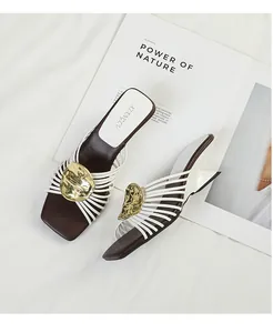 Elegant French style mules with irregular heels and gold radiating strap detail