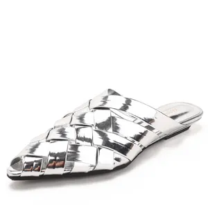 Stylish silver woven pointed-toe mules for women with metallic finish and flat sole.