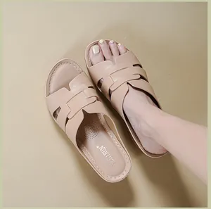 Elegant beige leather wedge sandals for women featuring a classic H-strap design