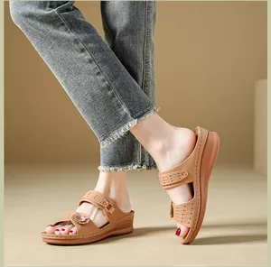 Vintage tan wedge slippers for women featuring delicate flower and laser-cut details