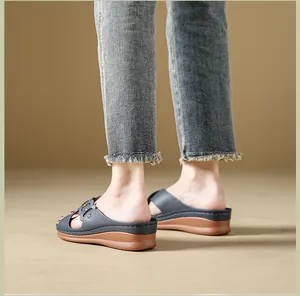 Side view of navy blue wedge slippers with comfortable thick platform sole
